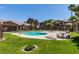 Enjoy the community pool surrounded by manicured landscaping and lounge chairs at 5751 E Hacienda Ave # 105, Las Vegas, NV 89122