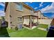 Exterior view of home with covered patio and well-maintained artificial lawn at 6231 Portland Treaty Ave, Las Vegas, NV 89122
