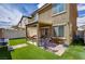 Backyard with artificial turf and patio area, perfect for outdoor entertaining at 6231 Portland Treaty Ave, Las Vegas, NV 89122