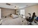 Large bedroom featuring carpeted floors, stylish accent wall and an office space at 6231 Portland Treaty Ave, Las Vegas, NV 89122