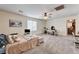 Spacious bedroom with a ceiling fan, carpeted floor and ample natural light at 6231 Portland Treaty Ave, Las Vegas, NV 89122