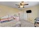 Bright bedroom with a ceiling fan and natural light at 6231 Portland Treaty Ave, Las Vegas, NV 89122
