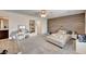 Spacious bedroom features a wood accent wall, carpet, and neutral walls at 6231 Portland Treaty Ave, Las Vegas, NV 89122