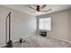 Well-lit bedroom featuring plush carpeting and a modern ceiling fan at 6231 Portland Treaty Ave, Las Vegas, NV 89122