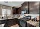 Charming kitchen features granite counters, stainless appliances, and ample cabinet space at 6231 Portland Treaty Ave, Las Vegas, NV 89122