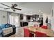 Stylish kitchen with modern appliances, a kitchen island, and an adjacent dining area at 6231 Portland Treaty Ave, Las Vegas, NV 89122