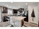 Well-equipped kitchen featuring dark cabinets, stainless steel appliances, and a functional center island at 6231 Portland Treaty Ave, Las Vegas, NV 89122