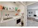 Convenient laundry room features washer, dryer, and ample shelving for storage at 6231 Portland Treaty Ave, Las Vegas, NV 89122