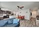 Open-concept living room and kitchen perfect for entertaining, with neutral walls and wood-look flooring at 6231 Portland Treaty Ave, Las Vegas, NV 89122