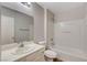 The bathroom features a shower-tub combo and modern single sink vanity with light-colored cabinets at 6549 Butterfly Sky St, North Las Vegas, NV 89084