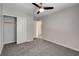 This bedroom features a ceiling fan, closet and light-colored walls at 6549 Butterfly Sky St, North Las Vegas, NV 89084