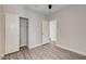Bedroom featuring wood-style floors, closet, and neutral-toned walls at 6549 Butterfly Sky St, North Las Vegas, NV 89084
