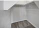 Bright closet with neutral walls, trim, and gray carpet flooring at 6549 Butterfly Sky St, North Las Vegas, NV 89084