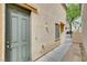 Side entrance to a home featuring a small patio at 6549 Butterfly Sky St, North Las Vegas, NV 89084