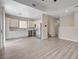 Modern kitchen with white cabinets, stainless steel appliances, and hardwood floors at 6549 Butterfly Sky St, North Las Vegas, NV 89084