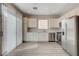 Bright kitchen with stainless steel appliances, marble countertops, and ample cabinet space at 6549 Butterfly Sky St, North Las Vegas, NV 89084
