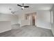 Spacious loft with gray carpet, vaulted ceiling, ceiling fans, and easy access to other rooms at 6549 Butterfly Sky St, North Las Vegas, NV 89084