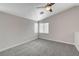 Loft area with vaulted ceiling, neutral walls, window with blinds, and gray carpet at 6549 Butterfly Sky St, North Las Vegas, NV 89084