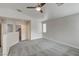 Loft featuring ceiling fan, vaulted ceiling, carpeted floors, and access to rooms via doors at 6549 Butterfly Sky St, North Las Vegas, NV 89084