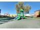 Neighborhood playground surrounded by shady trees, park benches, and Gathering-friendly play equipment at 6549 Butterfly Sky St, North Las Vegas, NV 89084