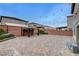 Paver stone backyard with a pergola and string lights at 6618 Tangled Vines Ave, Las Vegas, NV 89139