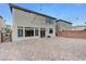 Wide shot of the backyard with paver stones and string lights at 6618 Tangled Vines Ave, Las Vegas, NV 89139