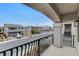 Balcony view of the neighborhood with contemporary style homes and colorful garage doors at 6618 Tangled Vines Ave, Las Vegas, NV 89139