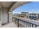 Balcony view of the neighborhood with contemporary style homes and colorful garage doors at 6618 Tangled Vines Ave, Las Vegas, NV 89139
