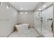 Modern bathroom featuring a soaking tub and glass-enclosed shower at 6618 Tangled Vines Ave, Las Vegas, NV 89139