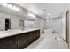 Luxury bathroom with double vanity, soaking tub, and glass-enclosed shower at 6618 Tangled Vines Ave, Las Vegas, NV 89139