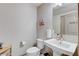 Modern half bathroom includes a white pedestal sink, toilet, and neutral wall color at 6618 Tangled Vines Ave, Las Vegas, NV 89139