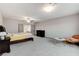 Spacious primary bedroom featuring carpet, a ceiling fan, and neutral paint at 6618 Tangled Vines Ave, Las Vegas, NV 89139