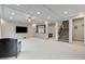 Living area featuring coffered ceilings, recessed lights, and hallway to stairs and kitchen at 6618 Tangled Vines Ave, Las Vegas, NV 89139