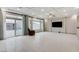 Large living area with recessed lighting, coffered ceiling, and a sliding glass door at 6618 Tangled Vines Ave, Las Vegas, NV 89139