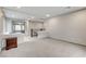 View of a large loft area with carpeting, a built-in desk, and neutral paint at 6618 Tangled Vines Ave, Las Vegas, NV 89139
