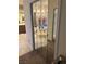 Mirrored closet reflects a luxurious bathroom with soaking tub and vanity at 6841 Longmeadow Dr, Pahrump, NV 89061