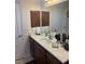 Bathroom featuring a vanity, a door, and a mirror at 6841 Longmeadow Dr, Pahrump, NV 89061