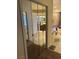 Mirrored closet reflects a luxurious bathroom with soaking tub and vanity at 6841 Longmeadow Dr, Pahrump, NV 89061