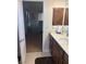 Bathroom leading to bedroom, featuring modern vanity and sink at 6841 Longmeadow Dr, Pahrump, NV 89061