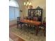 Dining room with a lovely rug and a large china cabinet, perfect for hosting gatherings and displaying cherished items at 6841 Longmeadow Dr, Pahrump, NV 89061