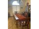 Cozy dining room with decorative chandelier and china cabinet, creating a warm ambiance for Gathering meals and dinner parties at 6841 Longmeadow Dr, Pahrump, NV 89061