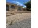 Attractive home with arched entry and desert-style rock landscaping, offering a low-maintenance and visually appealing outdoor space at 6841 Longmeadow Dr, Pahrump, NV 89061