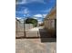 Sturdy metal gate securing access to the backyard or property, providing security and privacy at 6841 Longmeadow Dr, Pahrump, NV 89061