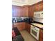 Kitchen with oak cabinets, granite countertops, and stainless steel appliances at 6841 Longmeadow Dr, Pahrump, NV 89061