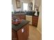 Kitchen with oak cabinets, granite countertops, and stainless steel sink at 6841 Longmeadow Dr, Pahrump, NV 89061