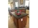 Kitchen island with matching oak cabinets and granite countertops at 6841 Longmeadow Dr, Pahrump, NV 89061