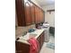 Laundry room with plenty of cabinet storage, sink, and a washer and dryer at 6841 Longmeadow Dr, Pahrump, NV 89061