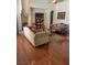 Spacious living room featuring hardwood floors, fireplace, and a built-in bookshelf at 6841 Longmeadow Dr, Pahrump, NV 89061