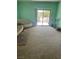 Bright living room with a sliding glass door leading to an outdoor patio at 6841 Longmeadow Dr, Pahrump, NV 89061