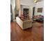Spacious living room featuring hardwood floors, fireplace, and a built-in bookshelf at 6841 Longmeadow Dr, Pahrump, NV 89061
